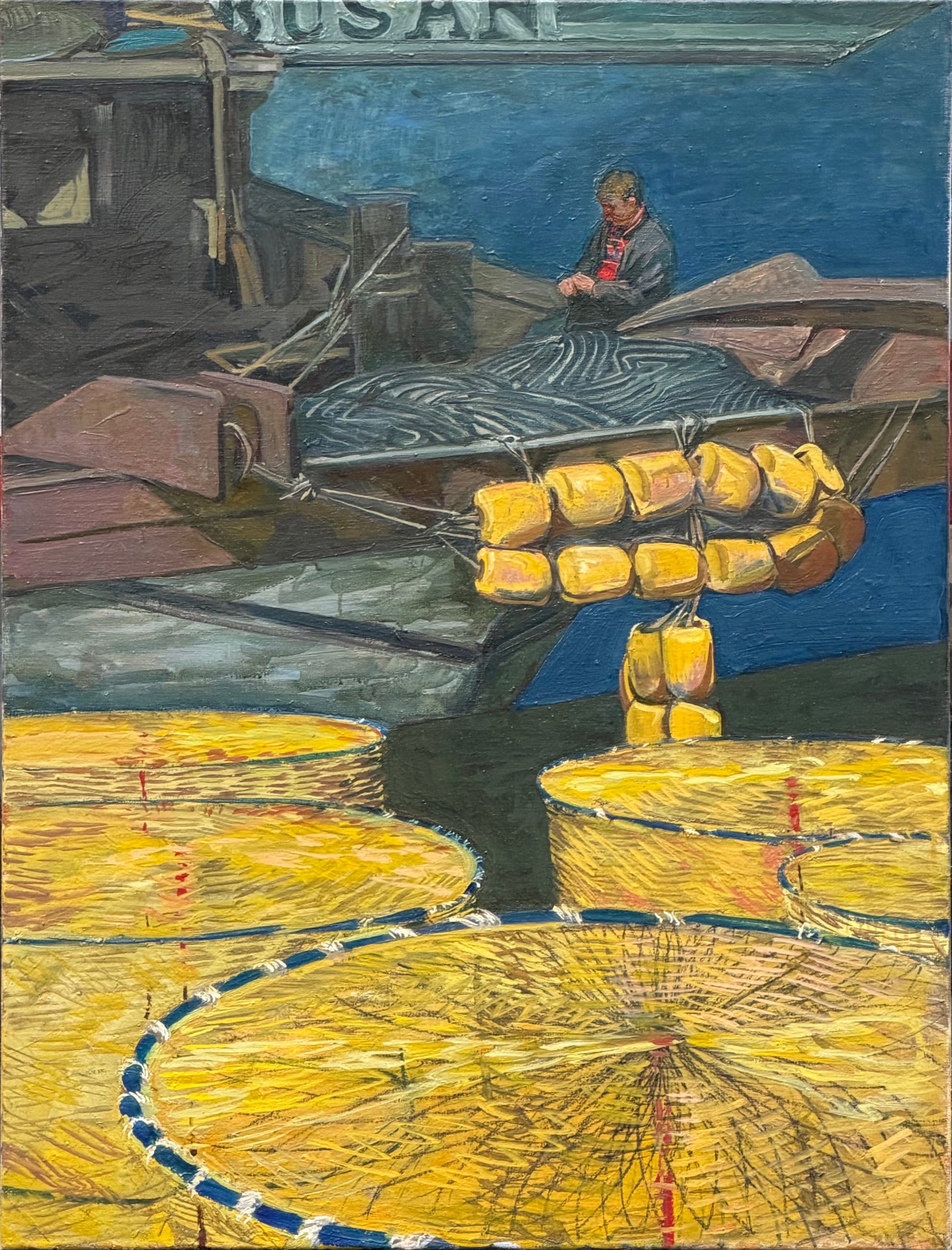 Busan harbour: yellow fishing nets and floats on the quay, a fisherman in a boat, BUSAN lettering on the hull